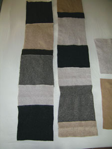 Piece together long strips using the rectangles. Then sew the large strips of pieced fabric together to create the throw.